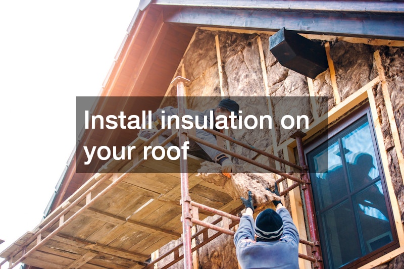 men installing roof insulation